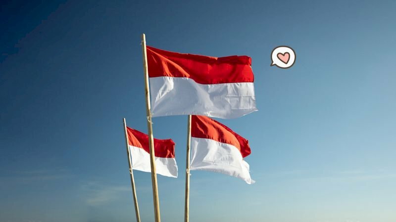 Hình ảnh các lá cờ Indonesia đang tung bay phấp phới giữa bầu trời xanh