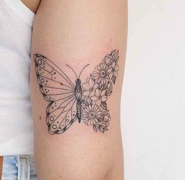 Hình xăm bướm nghệ thuật ở tay đen trắng