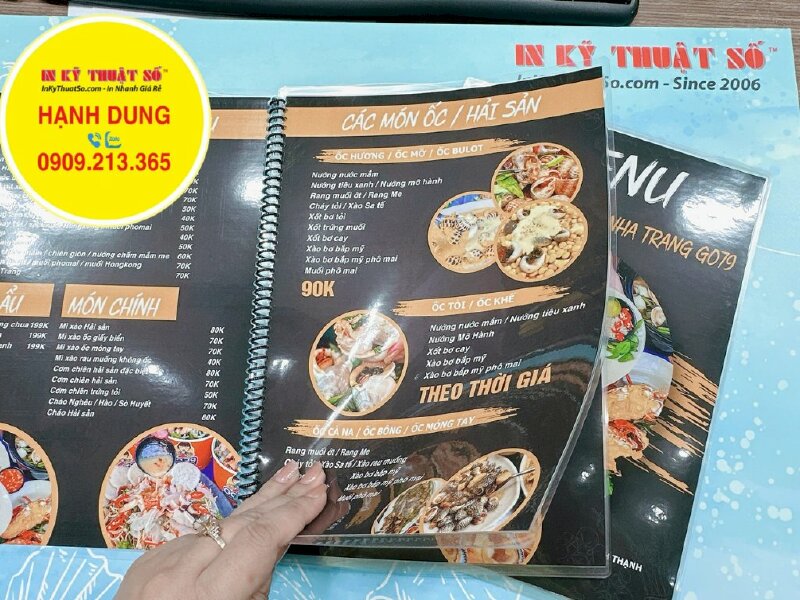 In menu quán ốc hải sản Nha Trang, cuốn menu giấy ép plastic - INKTS976