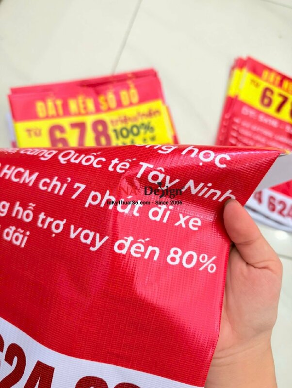 In băng rôn bán đất nền sổ đỏ kèm thông tin và số hotline môi giới bất động sản, in bạt hiflex xỏ cây trên dưới - INKTS2225